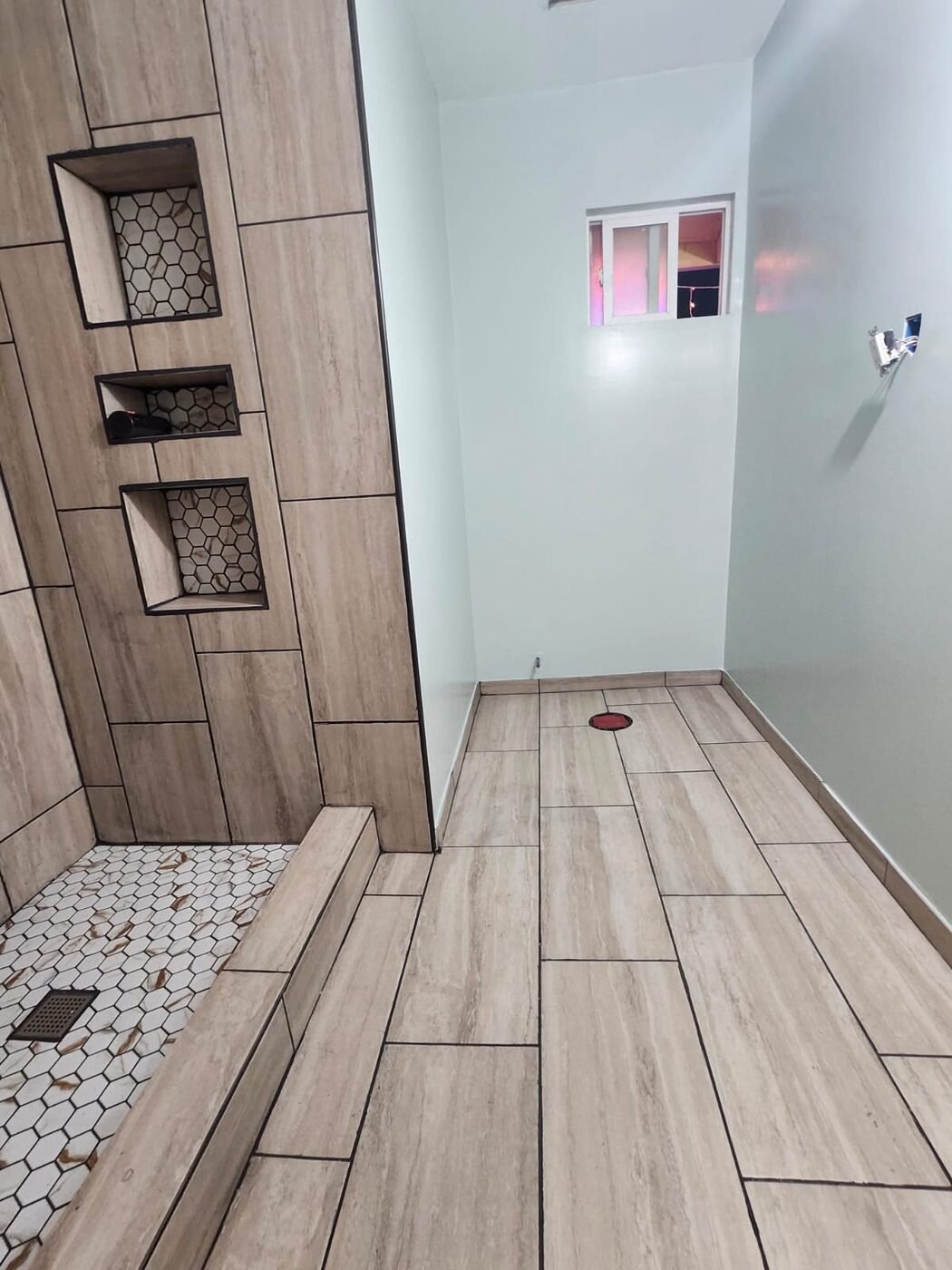 Finished custom tile shower with niches