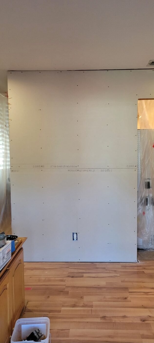 Drywall installation in progress